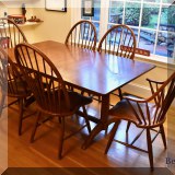 F09. Cherry wood Trestle table and 6 windsor style chairs 42&rdquo;h. 29&rdquo;h x 64&rdquo;w x 38&rdquo;d 